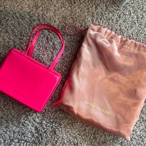 Amina Muaddi mini pink bag